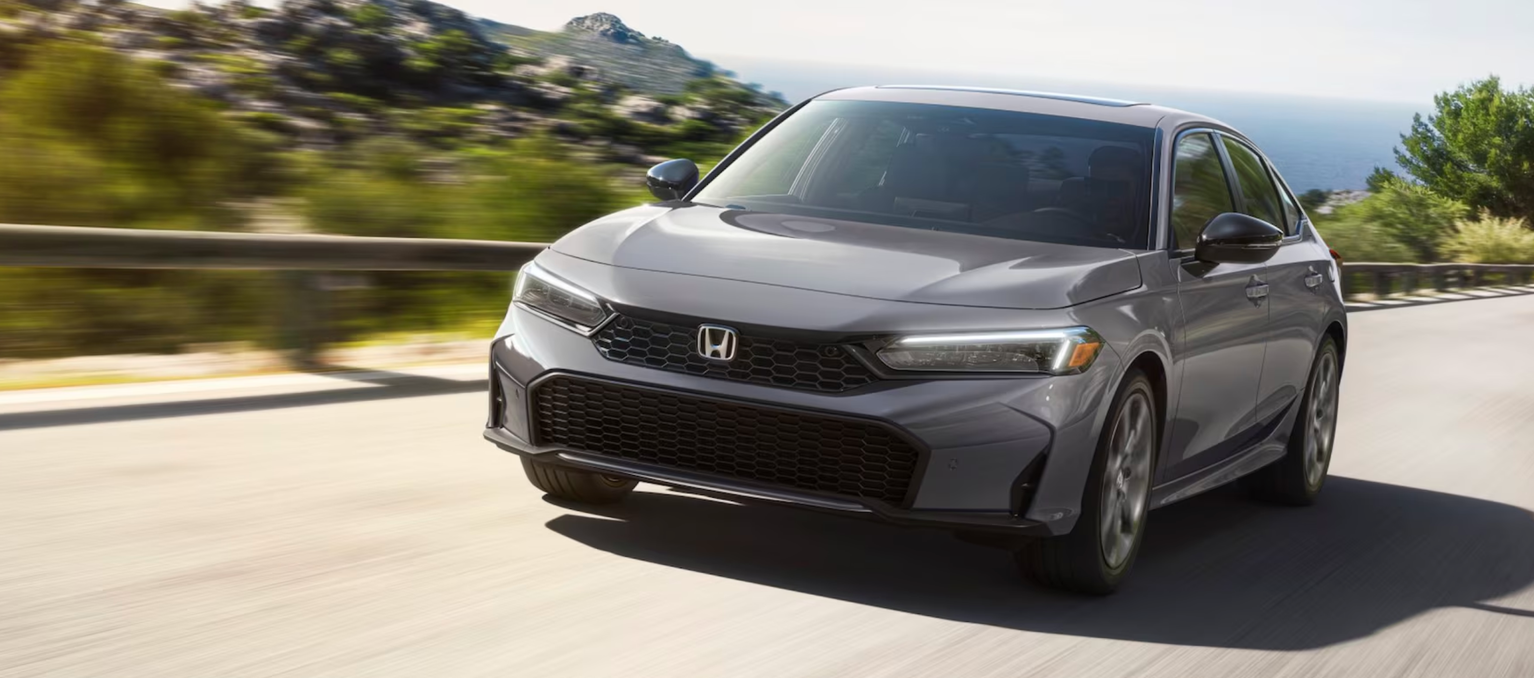 2025 Honda Civic Sedan driving in Parkersburg, WV
2025 Honda Civic Sedan driving in Parkersburg, WV