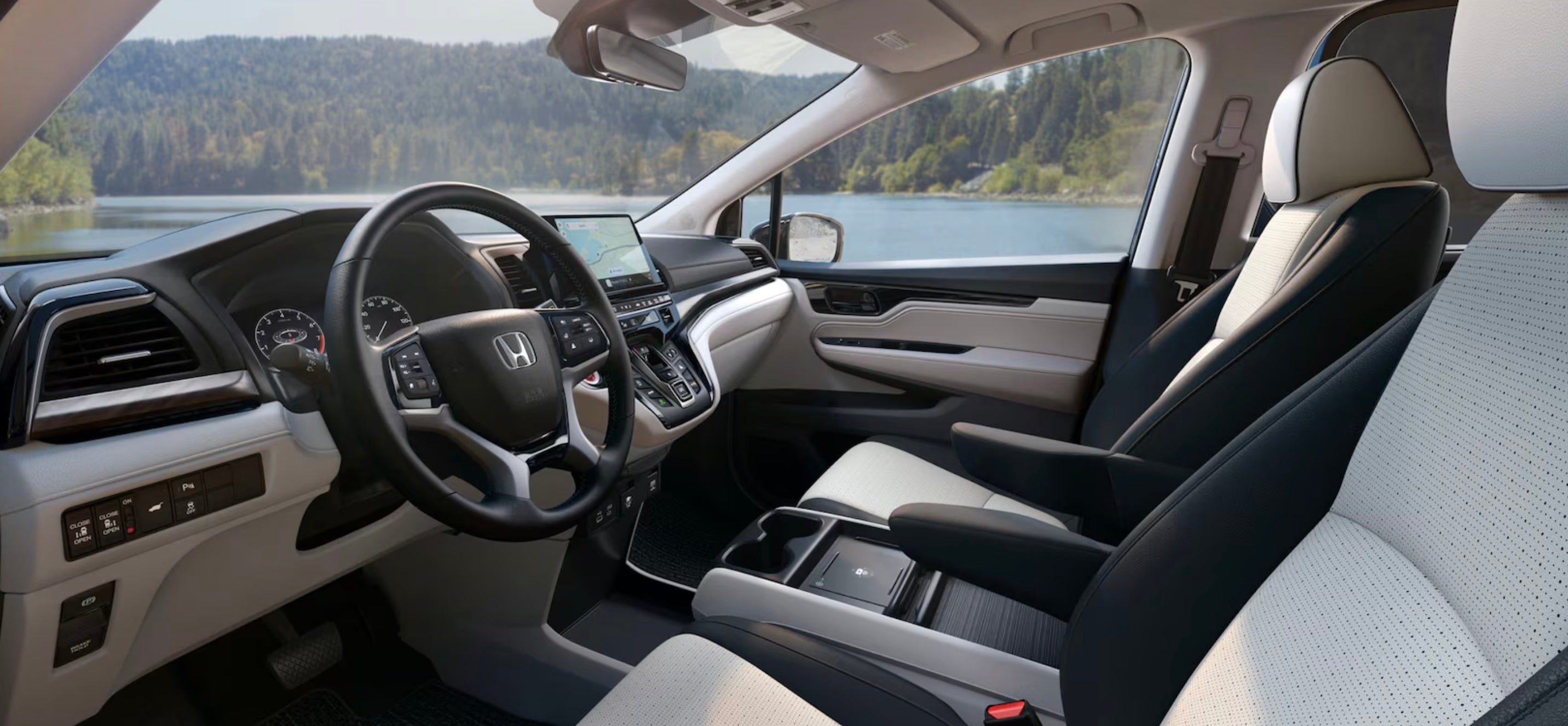 2026 Honda Odyssey Elite shown in Gray Leather